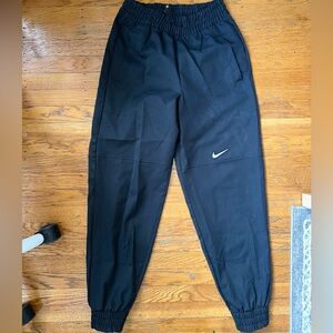 Nike Black Track Pants with Elastic Waistband and Tapered Legs